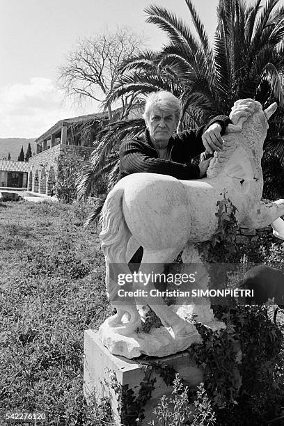 French actor Jean Marais in the garden of his Cabris home.