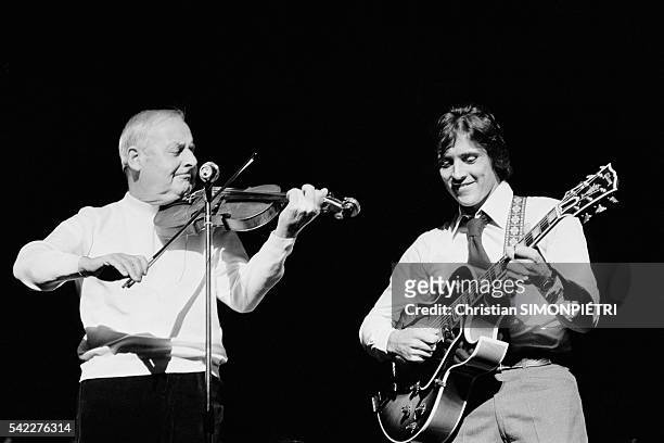 French singer Sacha Distel performing at the London Palladium with virtuoso violinist Stephane Grappelli.