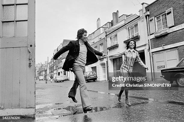 French singer Sacha Distel in London with his wife Francine Breaud.