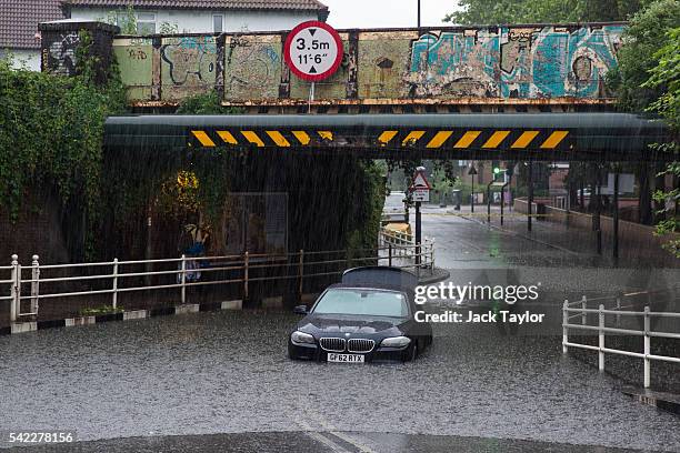 Car is abandoned under a bridge in Battersea after getting stuck in floodwater water on June 23, 2016 in London, England. Overnight thunderstorms...
