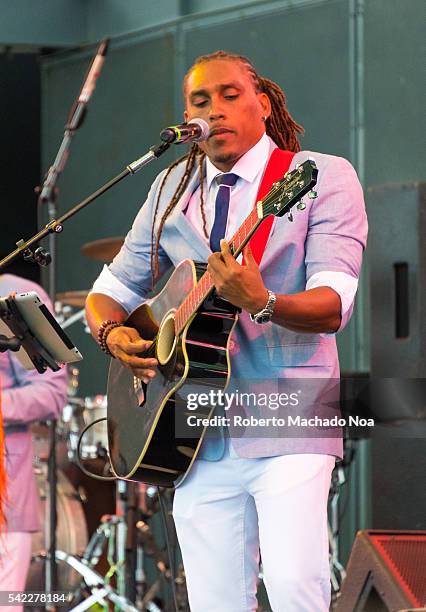 Arturo Tappin Band stage performing at Harbourfront centre. An initiative taken by Barbados Turism Marketing. Young man playing the guitar to...