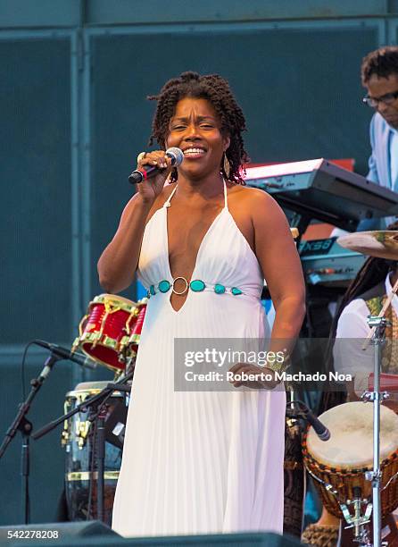 Arturo Tappin Band stage performing at Harbourfront centre. An initiative taken by Barbados Turism Marketing. Woman singing to crowd.