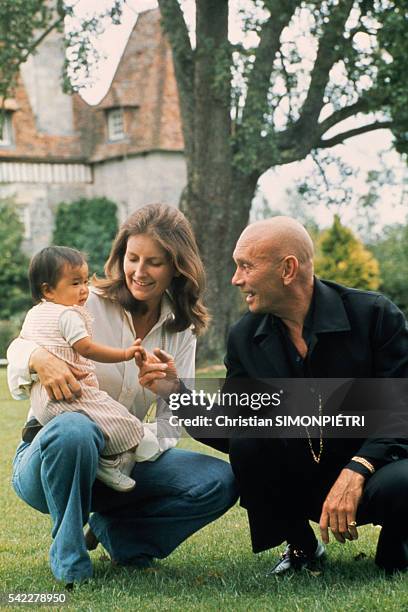 Russian-born American actor Yul Brynner with his third wife, Jacqueline de Croisset and his recently adopted Vietnamese daughter Mia, 10 months, at...