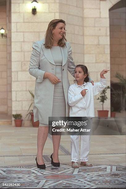 Soha and Zahwa Arafat in front of the presidentialpalace.