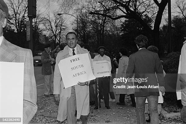 America singer, actor and social activist Harry Belafonte attends an anti-Apartheid demonstration in front of the South African embassy in Washington.