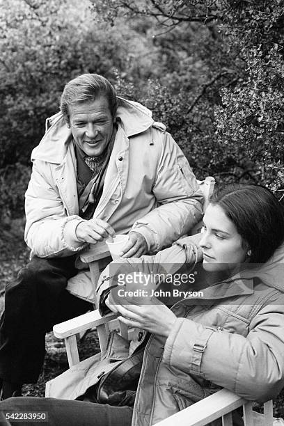 British actor Roger Moore and French actress Carole Bouquet on the set of the James Bond opus For Your Eyes Only, directed by John Glen.