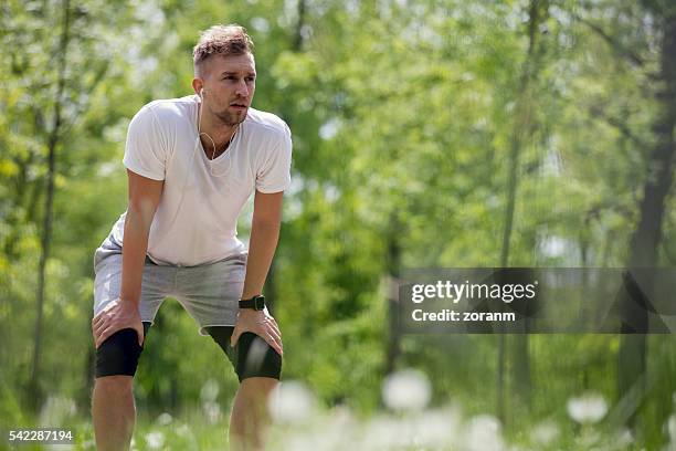 taking a break after run - runner resting stock pictures, royalty-free photos & images