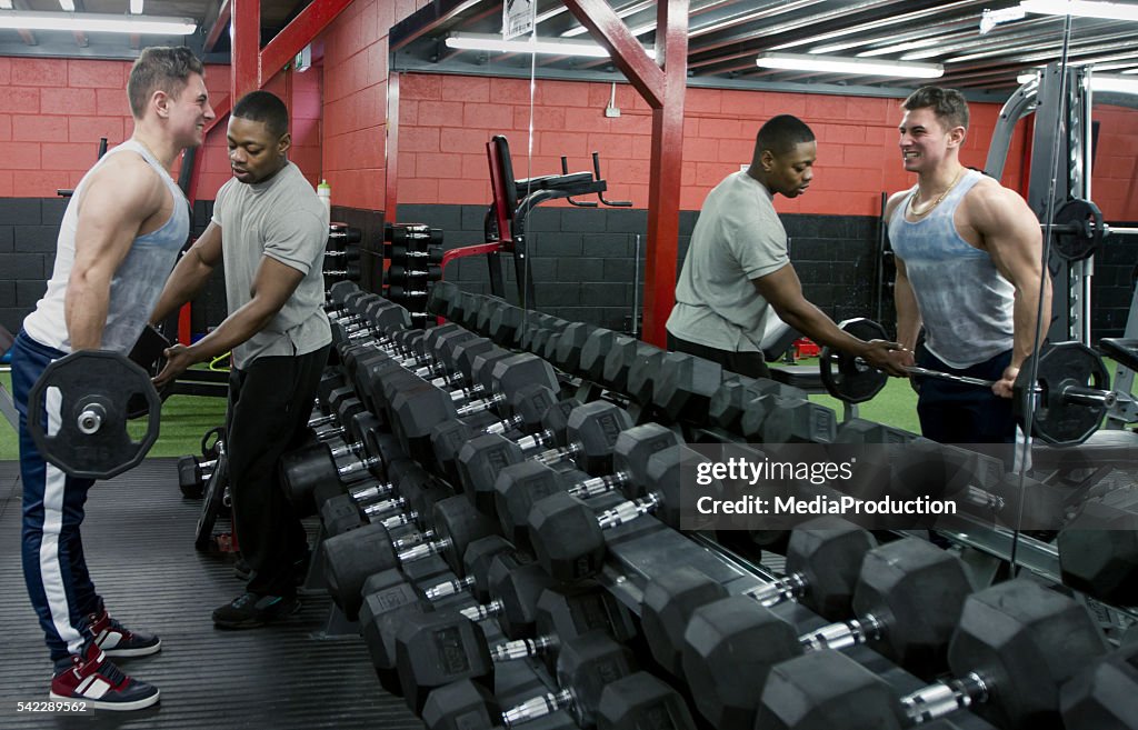 Personal trainer in the gym weight training