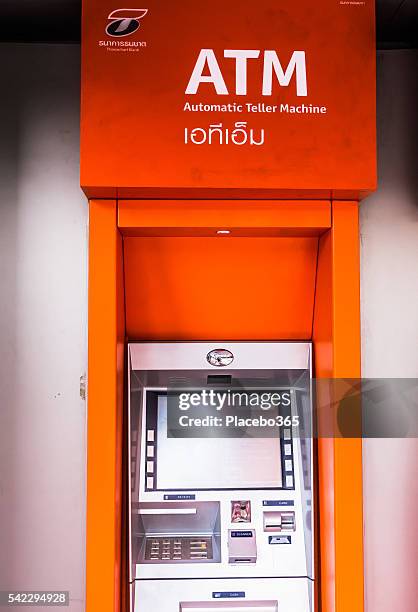 atm thanachart bank cashline dispenser - thai coin stock pictures, royalty-free photos & images