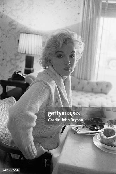 American actress, singer, and model Marilyn Monroe on the set of Let's Make Love, directed by George Cukor. Released in 1960.