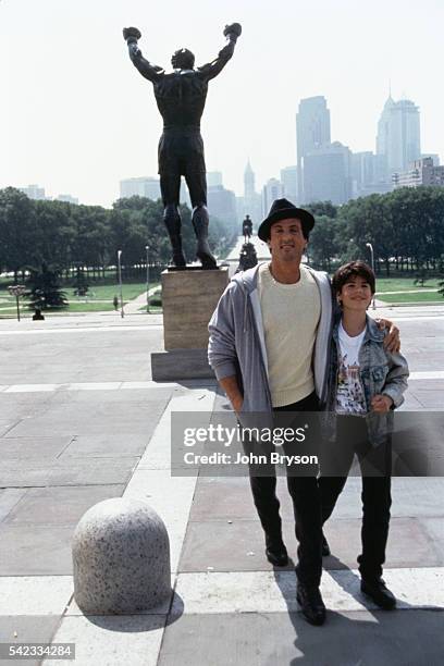 American actor, director, screenwriter, and producer Sylvester Stallone and his son Sage Stallone on the set of Rocky V, directed by John G. Avildsen.