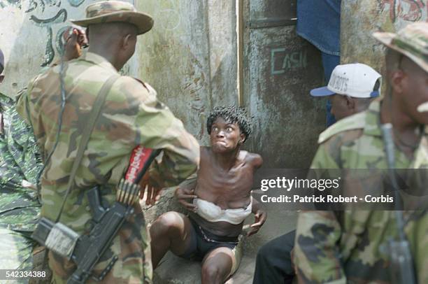 Woman accused of being a rebel is arrested at a checkpoint by the Nigerian army from Ecowas. She will be badly beaten for hours to force her...