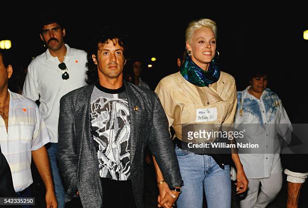 American actor, director, screenwriter and producer Sylvester Stallone and his partner, Danish actress and former model Brigitte Nielsen attend Demi...