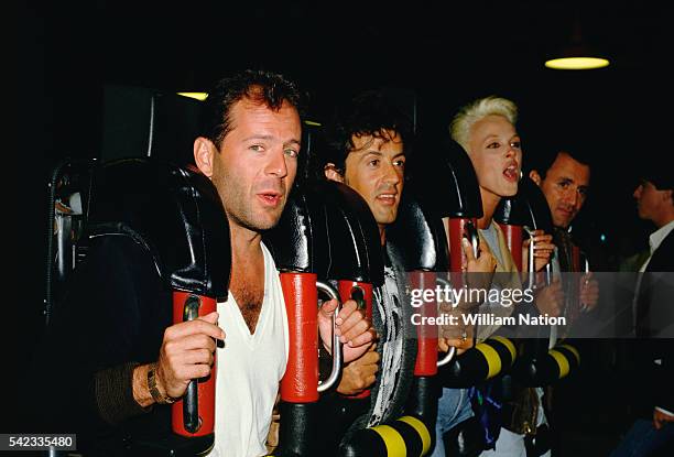 American actor Bruce Willis , actor Sylvester Stallone, and Stallone's partner, Danish actress and former model Brigitte Nielsen attend Demi Moore's...