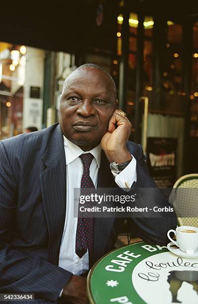 Portrait of the writer on a cafe terrace.