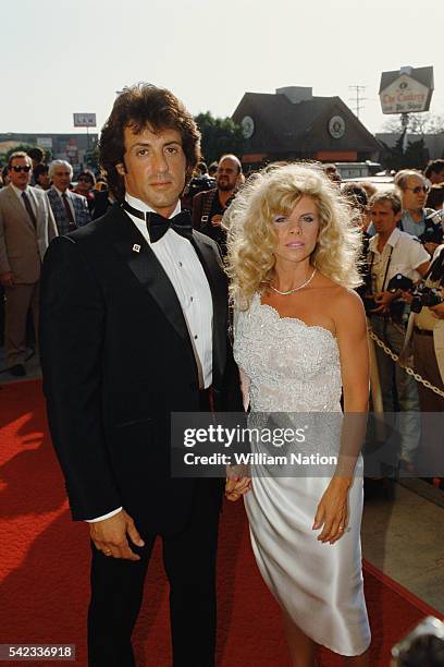 American actor, director, screenwriter and producer Sylvester Stallone and his wife Sasha Czack attend the premiere of the movie Rhinestone, directed...