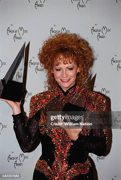 American singer and performer Reba McEntire wins 2 awards for Favorite Country Female Artist and Favorite Country Album for Reba Live at the 1991...