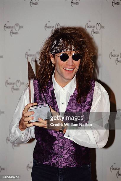 American singer and songwriter Jon Bon Jovi wins the award for Favorite Pop/Rock Single for Blaze of Glory at the 1991 American Music Awards.