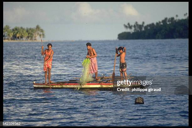 Fishing from an outrigger in the lagoon in Wallis.