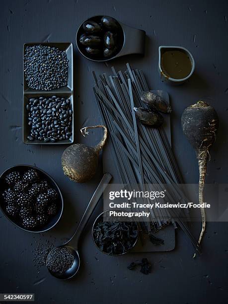 assortment of black foods - black olive stock pictures, royalty-free photos & images