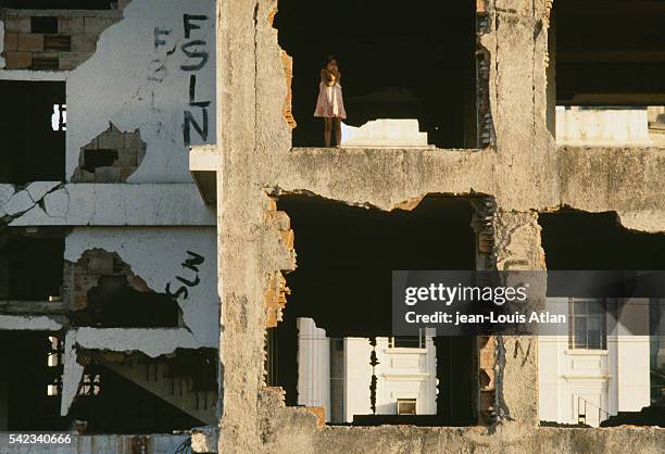 On the eve of Nicaragua's 1990 elections, a little girl lives in a building partially destroyed by the 1972 earthquake.