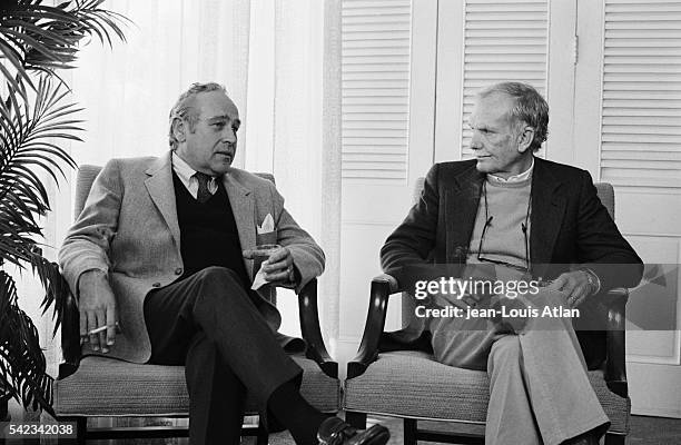 Director Sam Peckinpah chats with author Robert Ludlum in New York.
