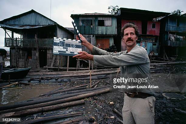 Director of Fitzcarraldo, Werner Herzog, on the movie set on location in Peru. Herzog with clapboard. | Location: Peru.