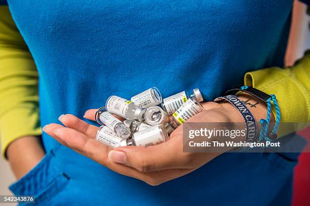 Certified medical assistant Karla Huerta holds vials of the HPV vaccination drug Gardasil at Amistad Community Health Center in Corpus Christi, Texas...