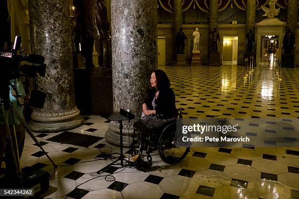 June 23: Rep. Tammy Duckworth , who is a participant in a sit-in on the House floor to demand a vote on gun control legislation, takes part in a TV...