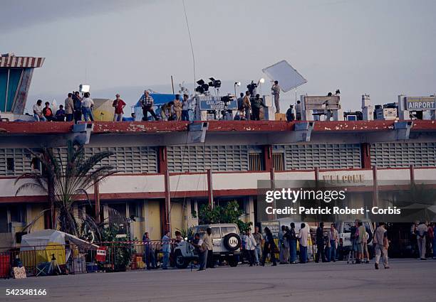 The world's press gather on the roof of Mogadishu airport, opposite the sea, for the arrival of US troops. The US Army launched Operation Restore...