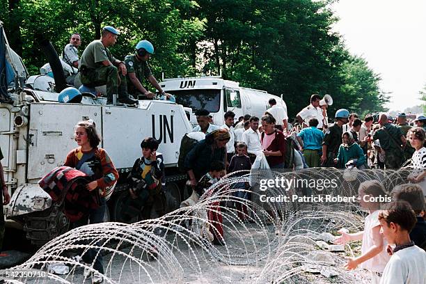 Bosnian refugees from Srebrenica arrive at the Tuzla refugee camp.