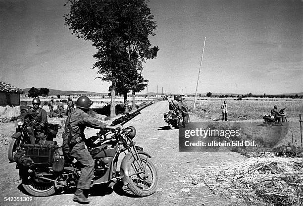 Spain, civil war 1936-39 - Italian volunteersof CTV on motorcycles with mounted machine-guns are deployed to comb through newly occupied territory...