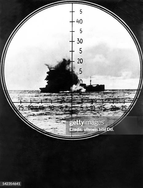 Naval warfare, U-Boat war: View through the periscope - a sinking enemy vessel hit by a U-boat torpedo.1942