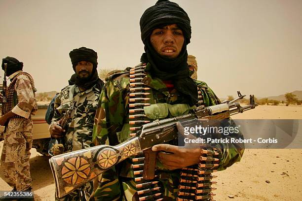 Tuareg rebels patrolling near their camp of Tigha, located in the north of Kidal. In March 2006, Malian army officer Hassan ag Fagaga, of Tuareg...