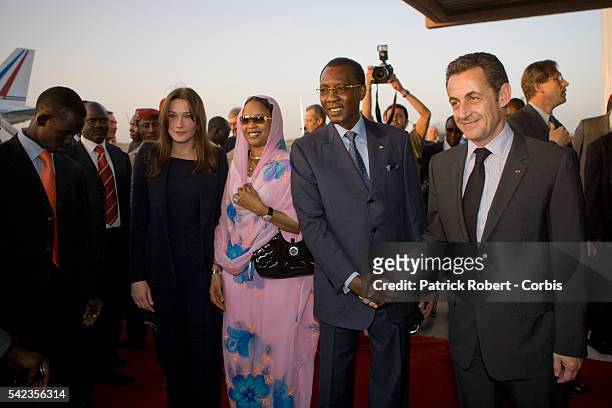 Chad's President Idriss Deby welcomes French President Nicolas Sarkozy prior to their arrival at the airport of N'Djamena.