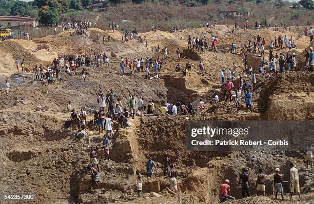 Employees working in a diamond mine. | Location: Kiodu, Sierra Leone.