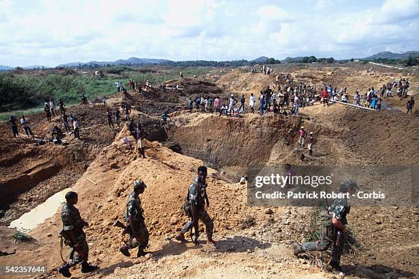 South African mercenaries patrol throughout the diamond mines. | Location: Kiodu, Sierra Leone.