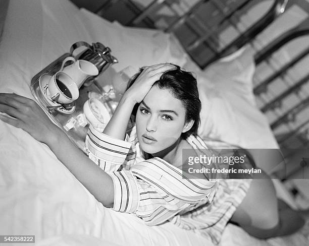 Italian actress and model Monica Bellucci wears a pyjama top designed by Lanvin Homme, 1990.