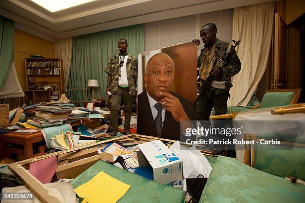 Republican Forces loyal to elected President Alassane Ouattara loot the residence of Laurent Gbagbo arrested earlier on April 11. Soldiers loyal to...