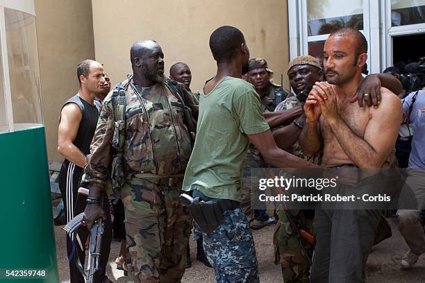 Michel Gbagbo, the son of the president Laurent Gbagbo is seen upon to his arrival at the Hotel du Golf. He has been beaten by the supporters of...