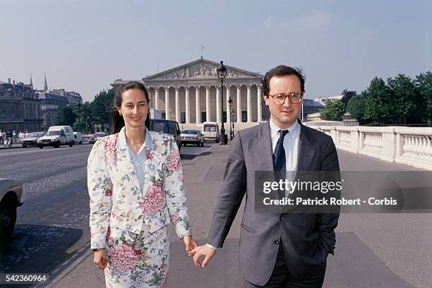 French socialist politicians Segolene Royal and husband Francois Hollande stand outside the National Assembly in Paris.