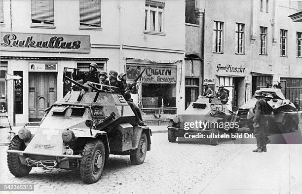 Campaign in Poland 01.- : 3.rd army offensive into west prussia . Armoured scout cars of the advance guard passing throug Dirschau beginning of...