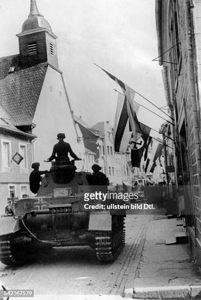 Campaign in the west / battle of France - Belgium : German tanks entering former german territory of Eupen/Malmedy in Belgium. Banner-Decorated...