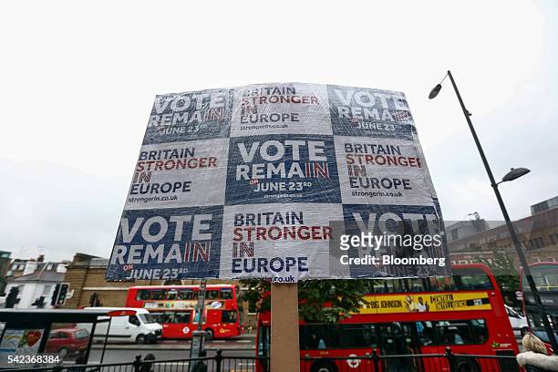 Britain Stronger In Europe" campaign placard stands covered in plastic wrapping to protect it from the rain near Angel London Underground station in...
