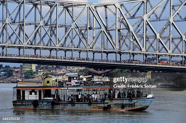 Howrah Bridge is a cantilever bridge with a suspended span over the Hooghly River, in West Bengal. It's a famous symbol of Kolkata.