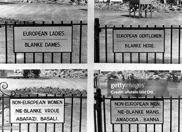 Signs both English and Afrikaans in Johannesburg, South Africa, 1957.