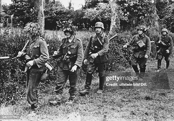 German assault detachment patrolling the area after the landing of the Allies in Normandy- June 1944