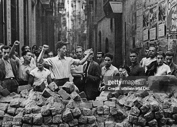 NRepublican forces set up barricades in Barcelona during the Spanish Civil War, 19-20 July 1936.
