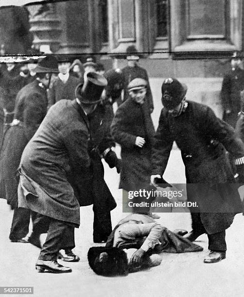 Feminism: demonstration of the suffragettes before the British Parliament in London: the police intervention- 1910