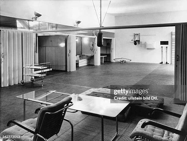 The 'house for the sportsman' by Marcel Breuer. There are no partitions, foldable walls and sliding panels divide the different lareas-...